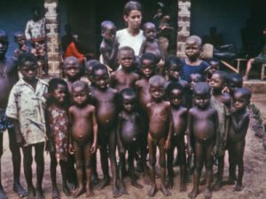 Children and a nurse attendant at a Nigerian orphanage in the la